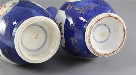 Two similar Chinese powder blue ground famille verte bottle vases, Kangxi period, height 27.7cm